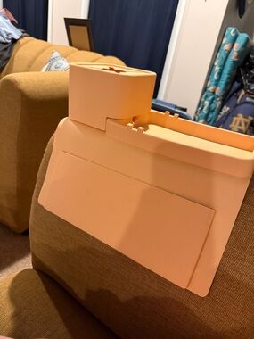 Peach colored silicone arm rest cup holder